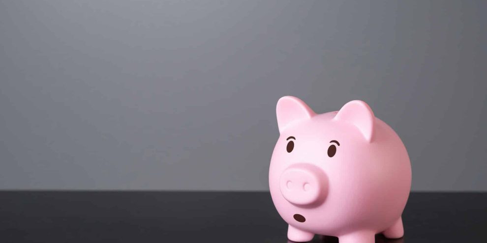 Surprised and worried piggy bank. Financial risks and saving savings.